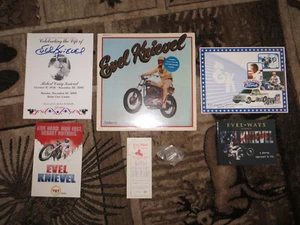 EVEL KNIEVEL LOT-BOOK, FUNERAL PROGRAM, 1974 SEALED LP, 1972 BRONZE COIN &TICKET - Picture 1 of 17
