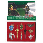 9 pièces. Ensemble porte-clés et collier The Legend of Zelda - ARME & EMBLÈMES Neuf