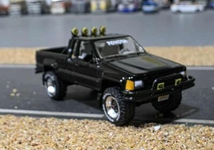 1/64 SCALE JOHNNY LIGHTNING BACK TO THE FUTURE TOYOTA HILUX NEW ON DISPLAY CARD - Picture 1 of 5