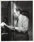 1975 Press Photo William "Bill" Russey, trustee for school board reads document
