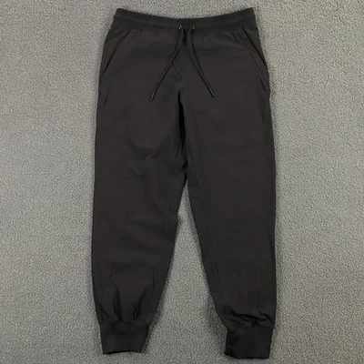 Pantalones de yoga Alo para hombre medianos negros de nailon atléticos cintura elástica con puños Foto 1 de 4