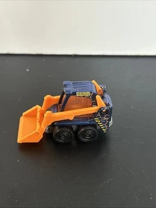 MATCHBOX SKIDSTER CAJA DE JUGUETES CONSTRUCCIÓN AZUL Y NARANJA 2 1/8" DIECAST BOBCAT -2009 - Imagen 1 de 6