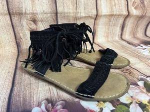 Sandalias planas Minnetonka negras con flecos para mujer talla 6 con corbata boho hippie - Imagen 1 de 10