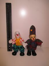 Funny Clowns colorful Clothing ceramic figures.