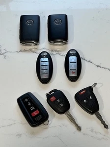 OEM Lot of 7 Automotive Key Fobs Mazda Nissan Toyota Jeep GUC - Picture 1 of 11