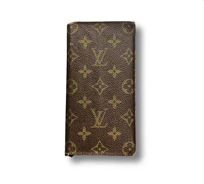 Louis Vuitton Long Bi-Fold Wallet In Monogram • 181.28€