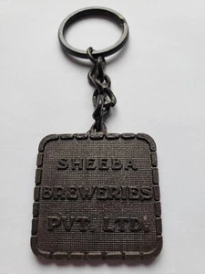 Sheeba Breweries PVT. LTD  India Key Chain Metal - Imagen 1 de 3