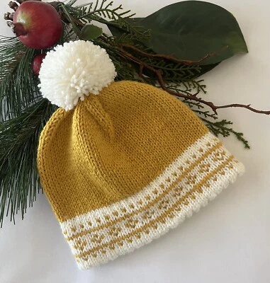 Sombrero de bebé tejido a mano con diseño de color nórdico y pompón Foto 1 de 3