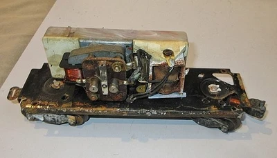 LIONEL #6466W TENDER FRAME W/TRUCKS,WHISTLE MOTOR & RELAY, (HELP) - Image 1 of 4