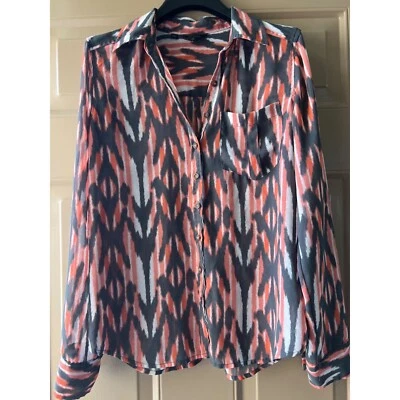 Top transparente Guess Chic con botones geométricos delanteros XS Foto 1 de 4