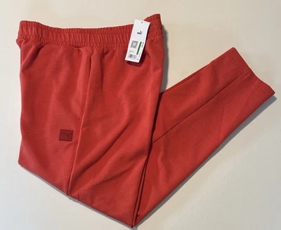 Pantalones deportivos Puma para hombre grandes naranja cónicos Foto 1 de 4