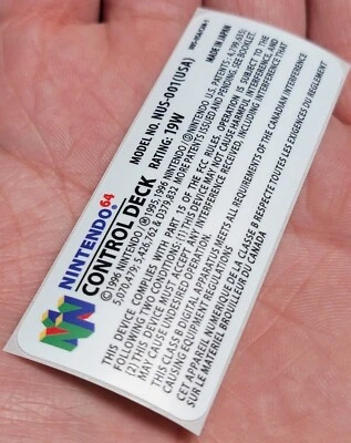PEGATINA ETIQUETA COLORIDA BLANCA NINTENDO 64 CUBIERTA DE CONTROL DE REPUESTO NUS-001 (EE. UU.) Foto 1 de 4