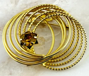 Gold Tone Open Circle Brooch with Amber Rhinestone Accents - Picture 1 of 7