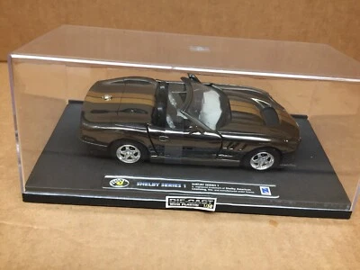 SHELBY AMERICA SERIES 1 DIE-CAST 1:32 RICH GOLD BLACK STRIPE 1999 BY NEWRAY - Image 1 of 4