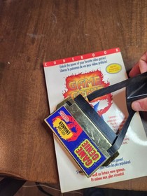 nes game genie with book broken tab