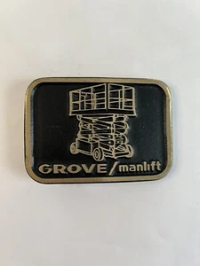 Hebilla de cinturón vintage de bronce macizo y negro para maquinaria pesada GROVE/MANLIFT de los años 70 - Imagen 1 de 4