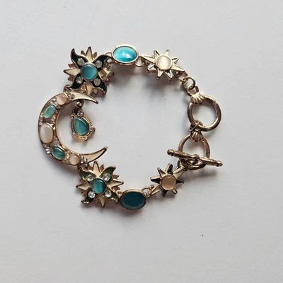 Pulsera con dije de estrella de luna celeste tono dorado azul piedras preciosas cierre de palanca Foto 1 de 3
