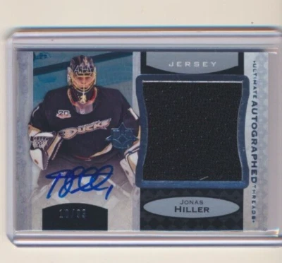 2013-14 UD Ultimate Collection Autographed Threads AUTO Jonas Hiller /99 Ducks - Image 1 of 2
