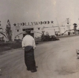 1935 Person Walking Hollywood Sign Iconic Background Expo Visit Portrait - Picture 1 of 3