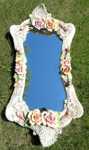 Vintage porcelain wall mirror with roses. (30 inches x 15 inches) Cover