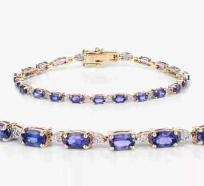 Brazalete de tenis de tanzanita azul de corte ovalado de 9 quilates enchapado en oro amarillo de 14 quilates Foto 1 de 4