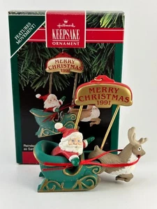 Up N Down Journey - 1991 Hallmark Ornament - Weihnachtsmann und Rentier mit Uhrwerk - Bild 1 von 10