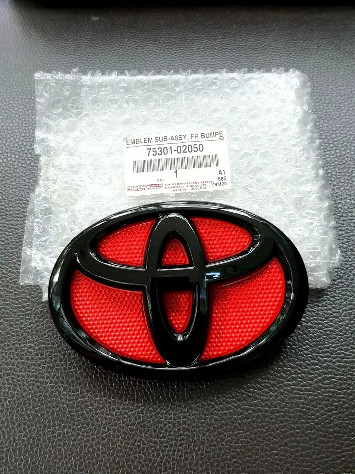 09-13 Toyota Corolla Red Black Front Grill Emblem 2009 2010 2011 2012 2013 - Image 1 of 4