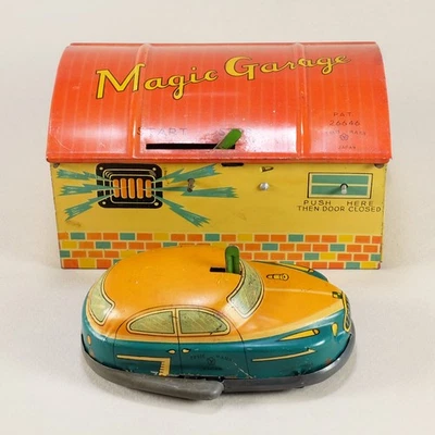 Garaje mágico de hojalata con coche de juguete de cuerda - De colección años 40-50 Yonezawa Japón Foto 1 de 4