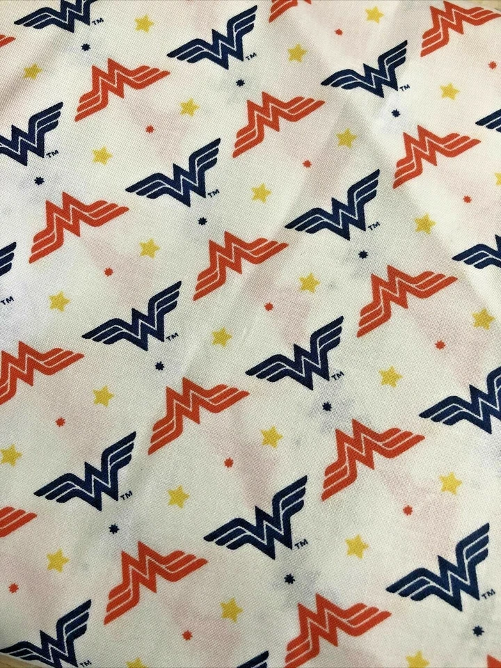 Wonder Woman - Red and Blue Logo - Yellow Stars - Camelot - 1 yard - Image 1 of 1