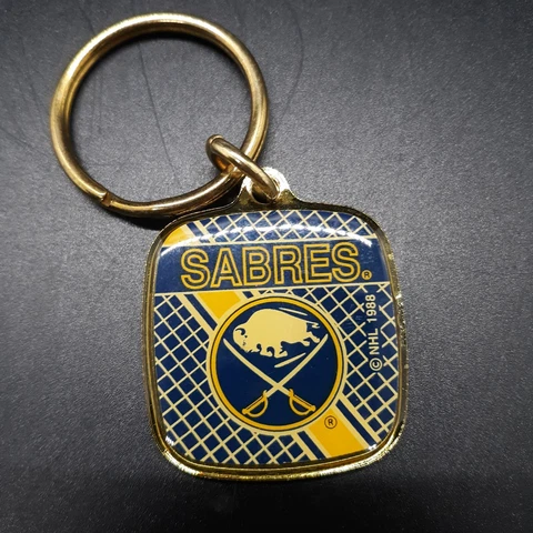 Vintage Wincraft 1988 NHL Buffalo Sabres Hockey 2" Gold Colored Keychain Cover