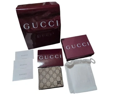 Autêntica carteira Gucci masculina web bege ébano GG Supreme lona bi dobra marrom - Imagem 1 de 4