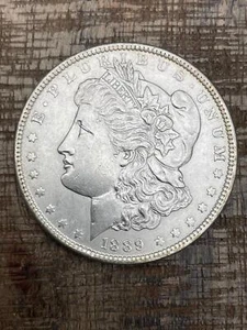 1889 $1 US Morgan Silver Dollar - Picture 1 of 2