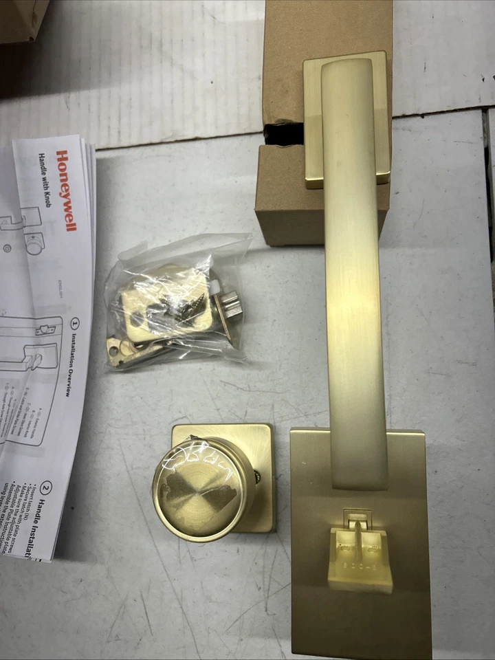 Manija de puerta de entrada interior/exterior oro satinado Honeywell 8120007 Foto 1 de 4