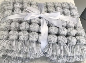 grey pom pom baby blanket