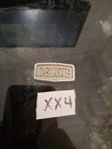 VINTAGE 1970S 80S TOYOTA COROLLA " DELUXE " PLASTIC SMALL STICK ON EMBLEM OEM - Picture 1 of 2