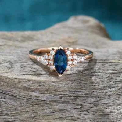Anillo para mujer 2 quilates con diamantes de zafiro azul creado en laboratorio de marquesa enchapado en oro rosa de 14 quilates Foto 1 de 4