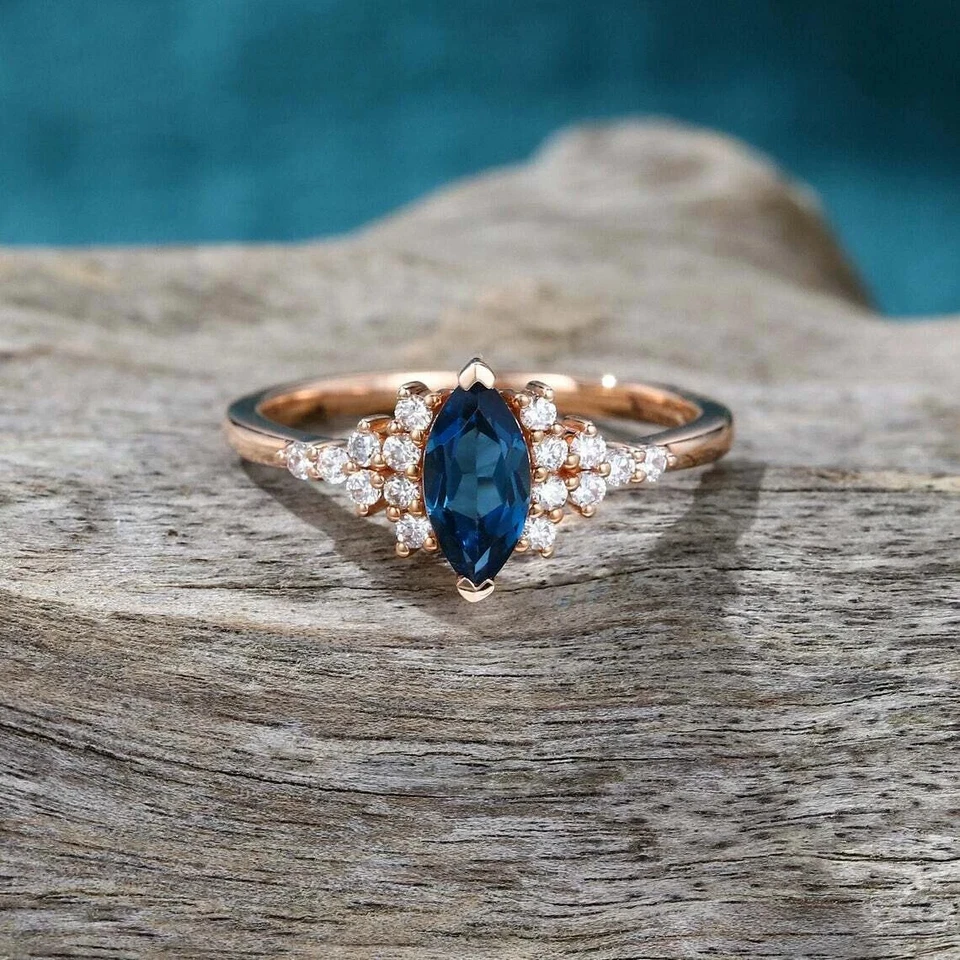 Anillo para mujer 2 quilates con diamantes de zafiro azul creado en laboratorio de marquesa enchapado en oro rosa de 14 quilates Foto 1 de 4