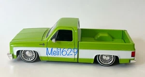Jada Street Low 1/24 1985 Chevy C-10 Pickup (grün/weiß) - Bild 1 von 7