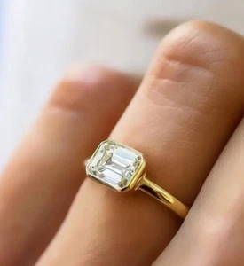 East To West Bezel Set Sterling Silver Total 1.50 CT Emerald Cut Moissanite Ring - Picture 1 of 3