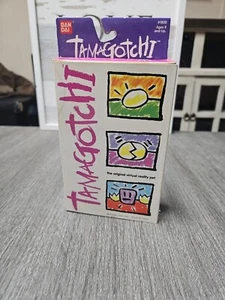 Tamagotchi Blue With Yellow Buttons - Picture 1 of 4