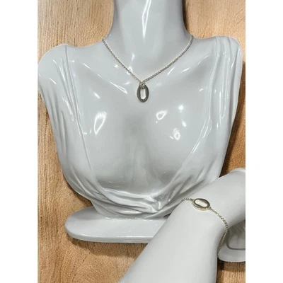 Juego de collar y pulsera colgante ovalado de plata de ley Coach 99776/99762 Foto 1 de 4