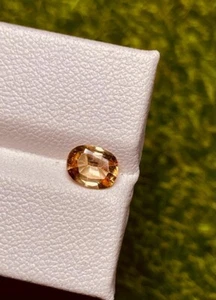 0.79CT Dream Collection 100% Natural Color Change Axinite under penlight - Picture 1 of 3