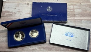 1886-1986 USA Liberty Coins Set PP SILBER Dollar & Half Dollar - Bild 1 von 2