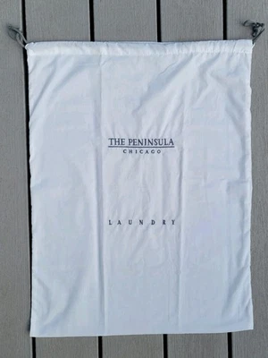 Bolsa de algodón con cordón para lavandería y tintorería The Peninsula New York Foto 1 de 3
