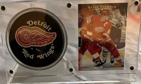 Steve Yzerman upper deck card with NHL official hockey puck Cover