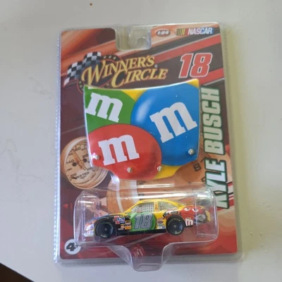 2010 Winners Circle #18 M&M's Kyle Busch 1/64 w/Replica Hood NEW - Image 1 of 3