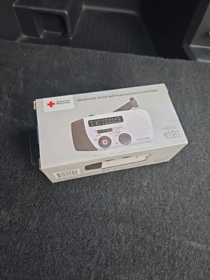 Etón Microlink FR150 AM/FM/WX Radio Flashlight, solar+crank+USB+phone charging  - Image 1 of 4