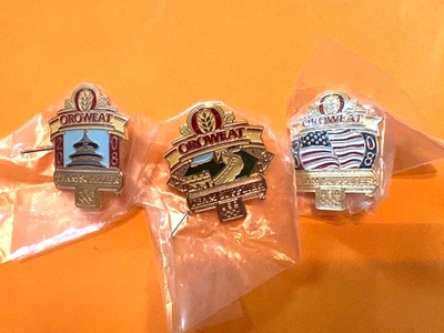 JUEGO DE 3 PINES OLÍMPICOS DE PEKÍN OROWEAT PAN PROVEEDOR GRAN PARED PALACIO BANDERA DE EE. UU. NUEVO EN PAQUETE Foto 1 de 4