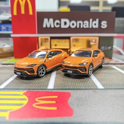 Modelo de coche fundido a presión naranja 2 piezas Mini GT 1/64 Lamborghini Urus Arancio Borealis Foto 1 de 4