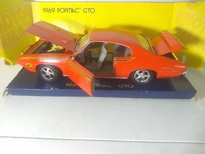 Neu Motormax 1:24 1969 Pontiac GTO THE JUDGE - orange Sammler Druckguss Replik - Bild 1 von 12